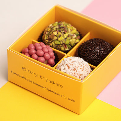 Box of assorted 4 pieces Brigadeiro chocolates with a decorative box on a colorful background